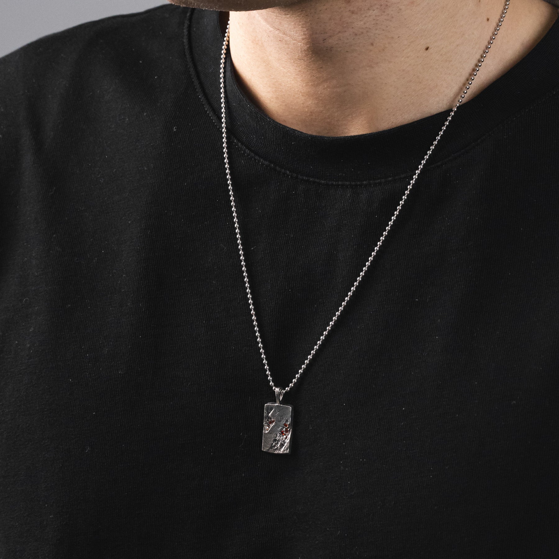 GOLGA SANGUINIS cross pendant in volcanic-oxidized 925 silver with red stones, handcrafted in Italy for you - Broken Hearts